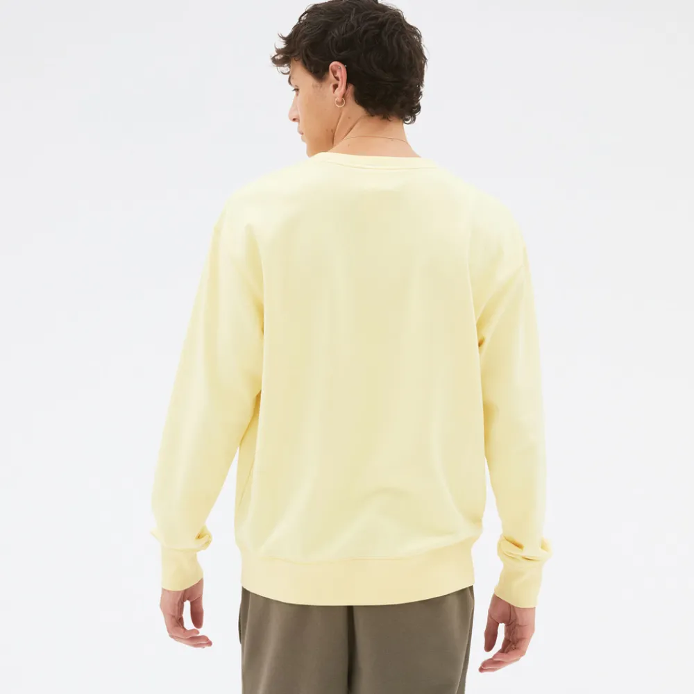 New Balance Bluza unisex UT21501MZ – żółta