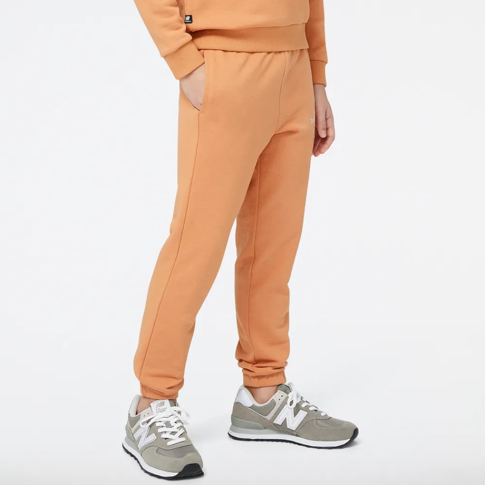 New Balance Spodnie dziecięce YP31508SEI – pomarańczowe