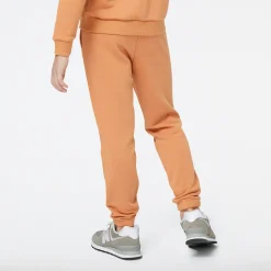 New Balance Spodnie dziecięce YP31508SEI – pomarańczowe