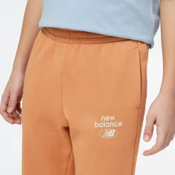 New Balance Spodnie dziecięce YP31508SEI – pomarańczowe