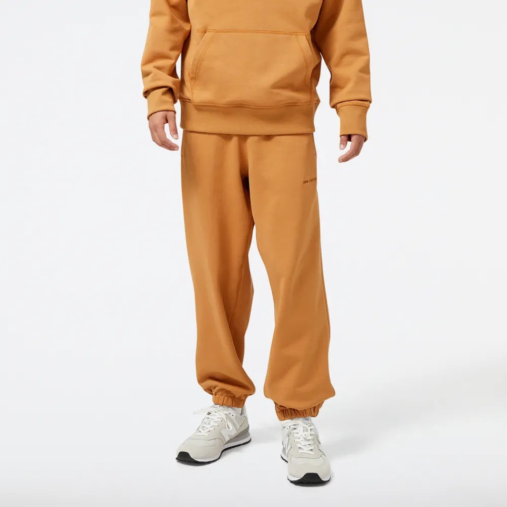 New Balance Spodnie męskie MP23551TOB – pomarańczowe