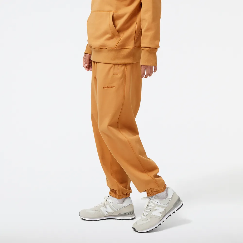 New Balance Spodnie męskie MP23551TOB – pomarańczowe