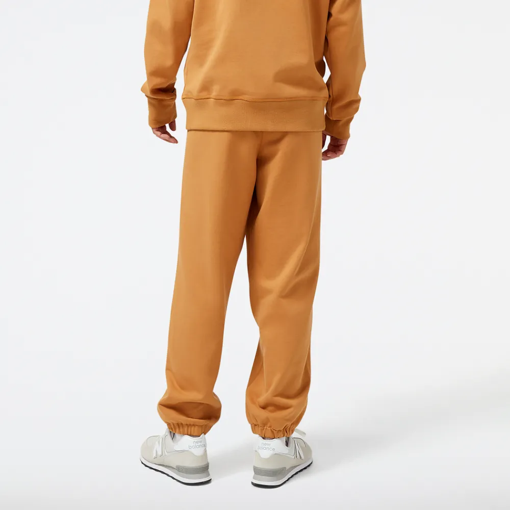 New Balance Spodnie męskie MP23551TOB – pomarańczowe