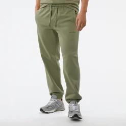 New Balance Spodnie męskie MP23551OLF – zielone