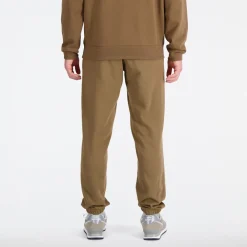 ODZIEZ BIEGOWA*New Balance ODZIEZ BIEGOWA Spodnie męskie MP31539DHE – brązowe