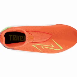PIKANOENA*New Balance PIKANOENA Turfy dziecięce TEKELA V4 MAGIQUE JNR FG SJT3TDF4 – pomarańczowe